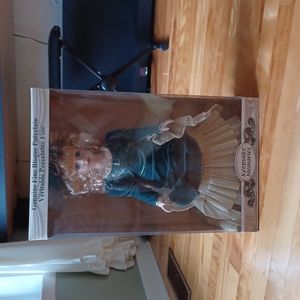 Porcelain Doll in Green Gown